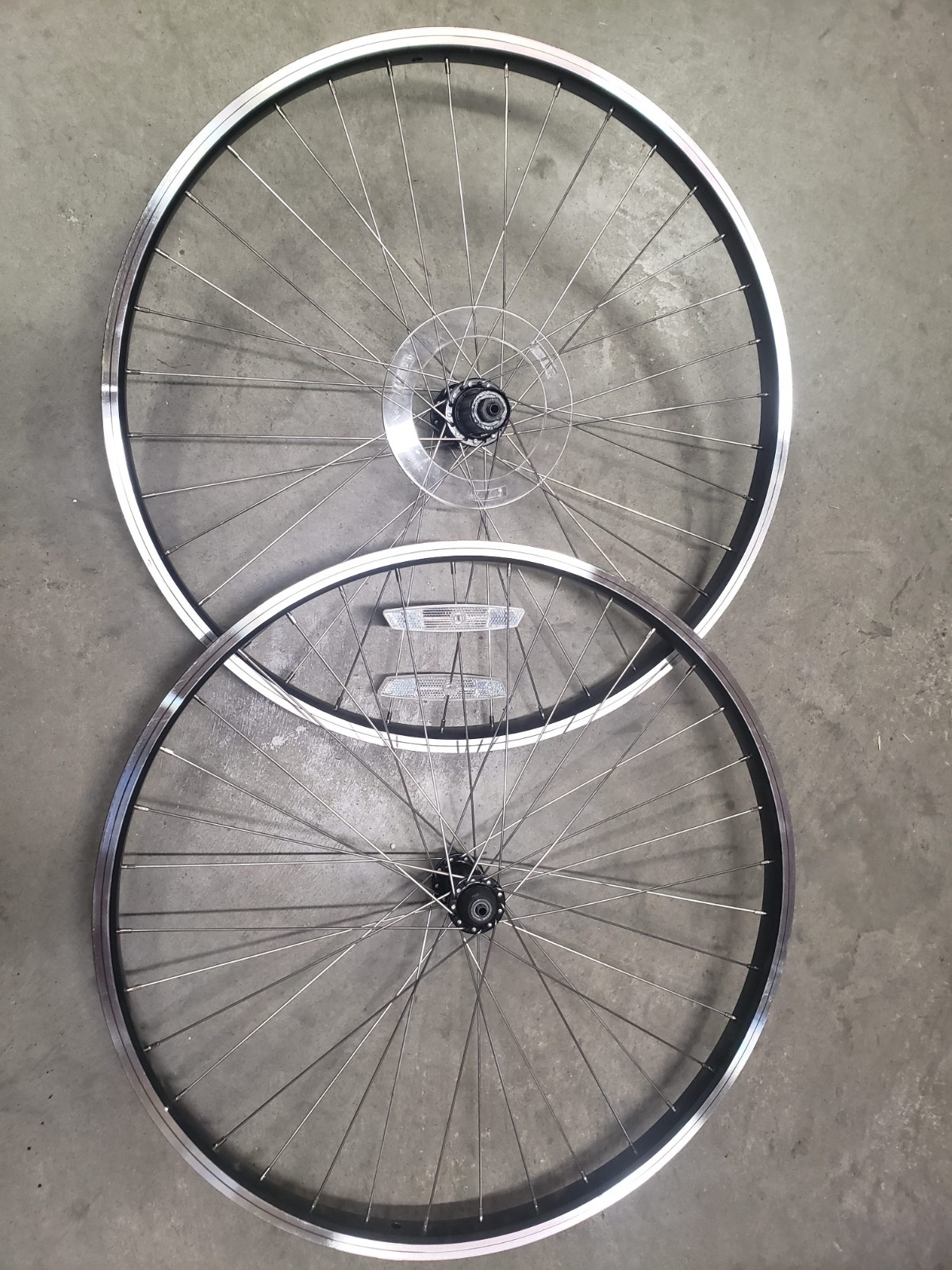 26" rim brake wheelset. Double wall. Black with silver sidewall and black hub.