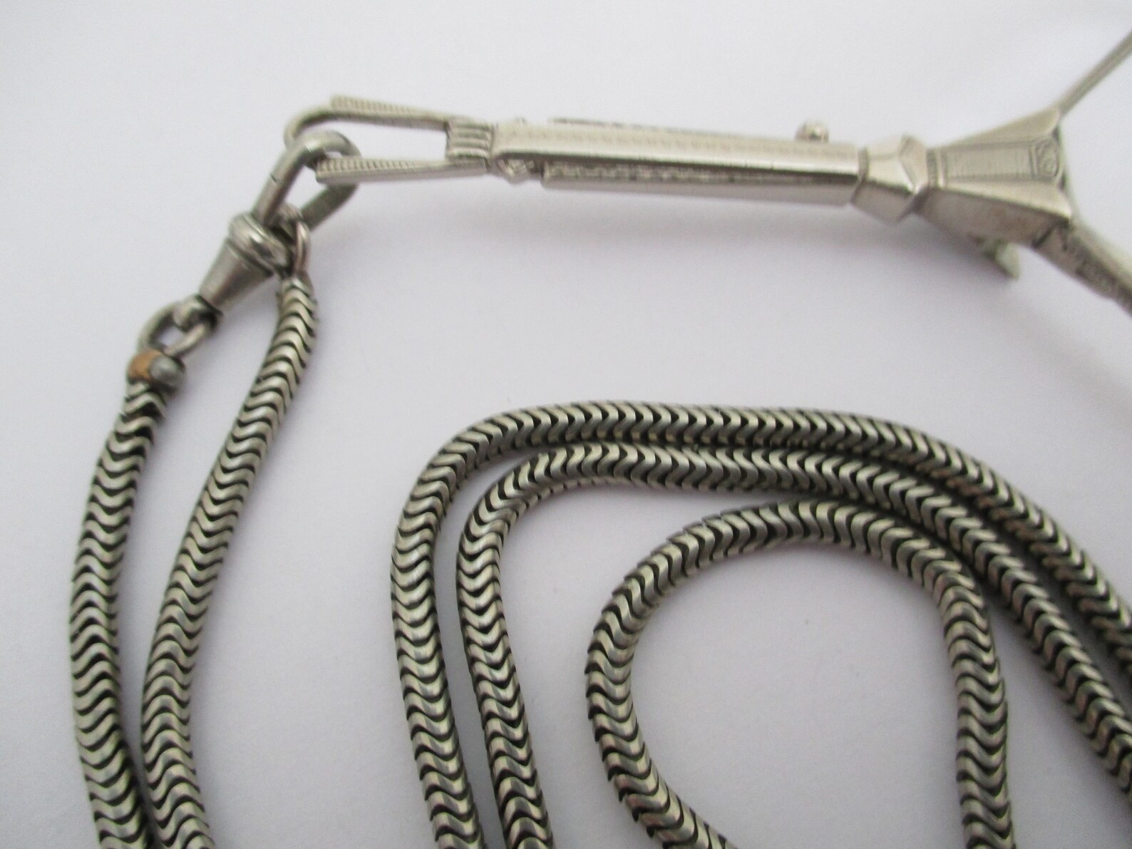 A Deco style lorgnette with guard chain