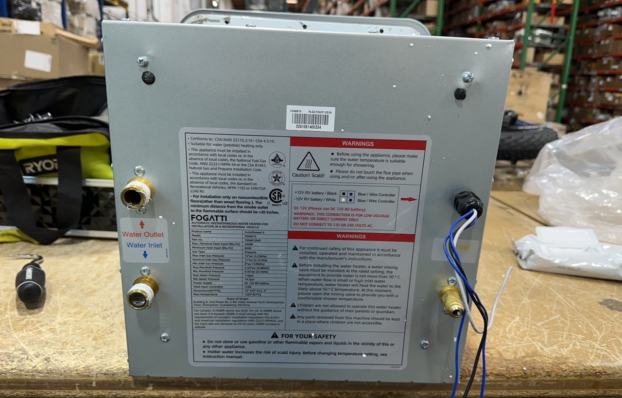 Used 2.5GPM 48,000 BTU RV Tankless Water Heater with 15x15 White Door