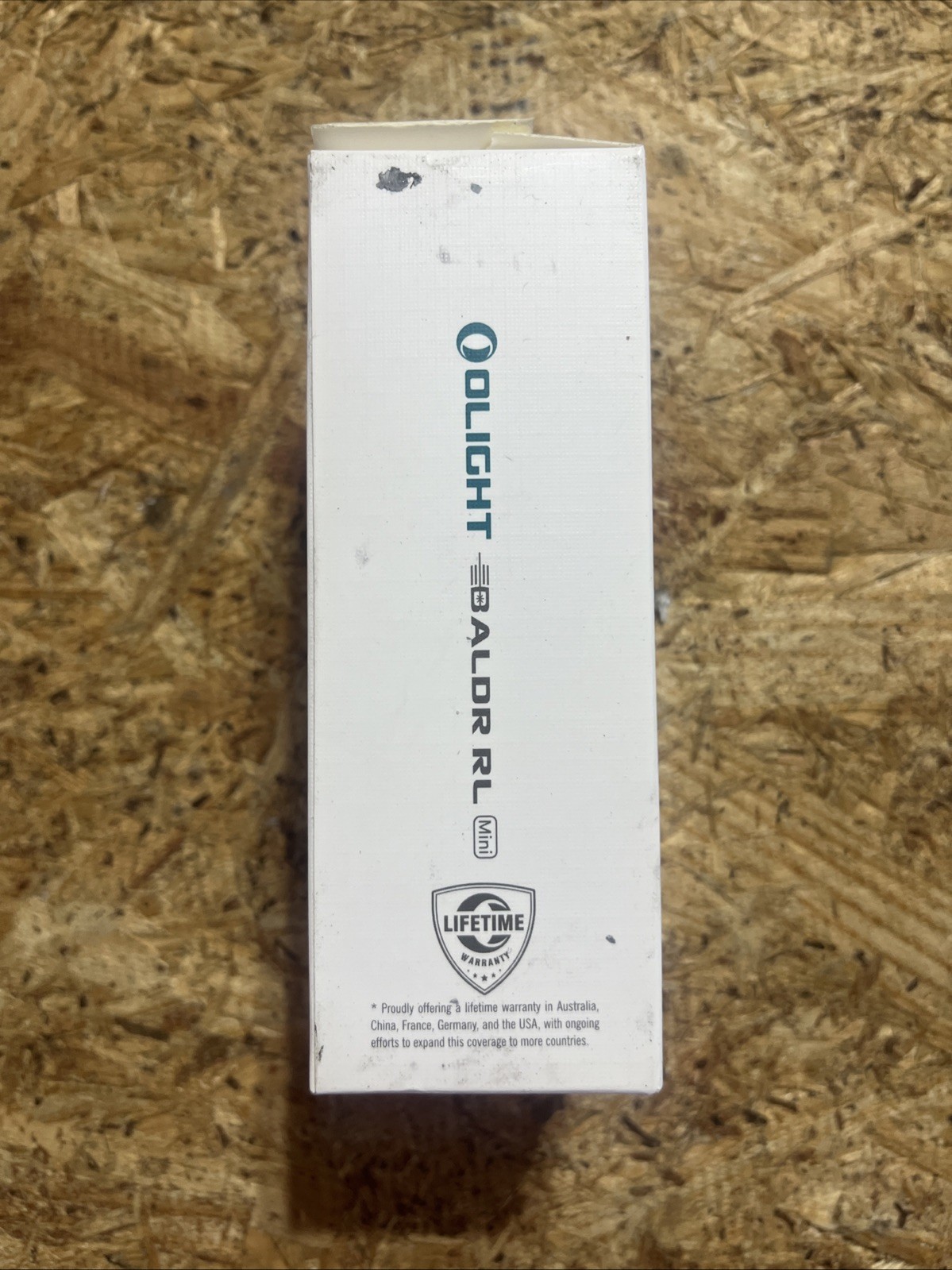 Olight Baldr RL Mini tactical light with red beam laser, black