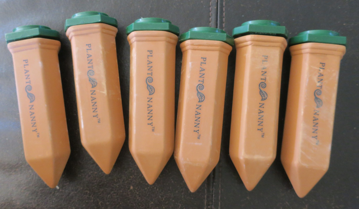 6 Terracotta PLANT NANNY Watering Spikes with 2L adapters.