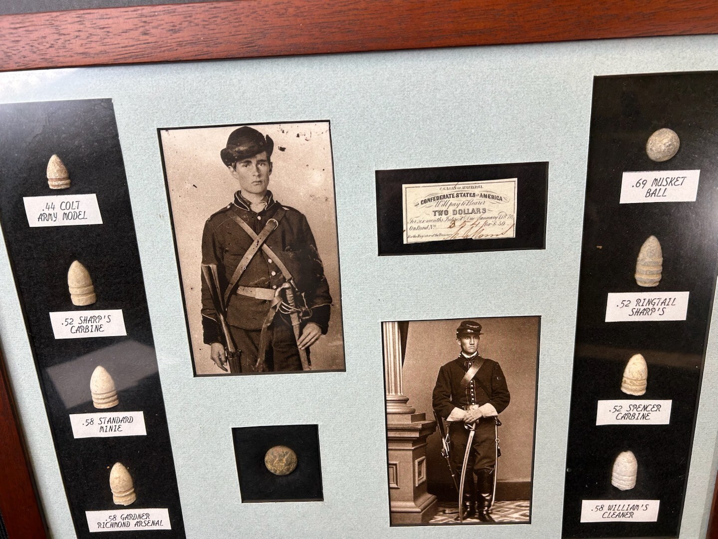 Original framed Civil War bullets and button