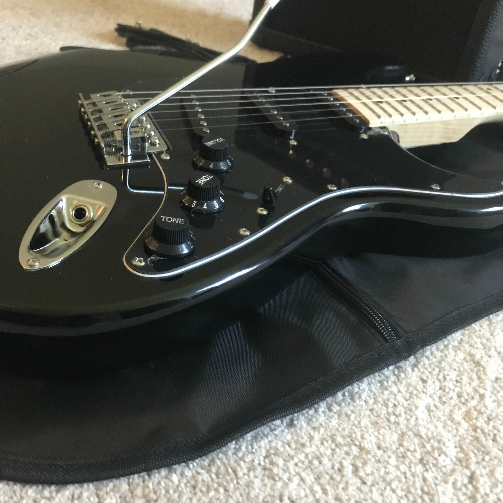 Full-Size Black Electric Guitar Starter Package with 20-Watt Amp and Accessories