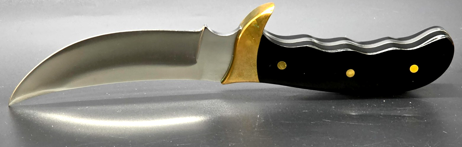 Buck Kalinga knife with black handle and brown leather sheath