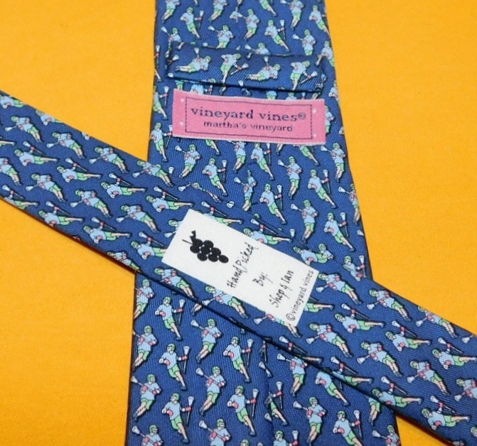 BOY'S VINEYARD VINES MADE IN U.S.A. BLUE/RED/YELLOW LACROSSE PLAYER MOTIF TIE.