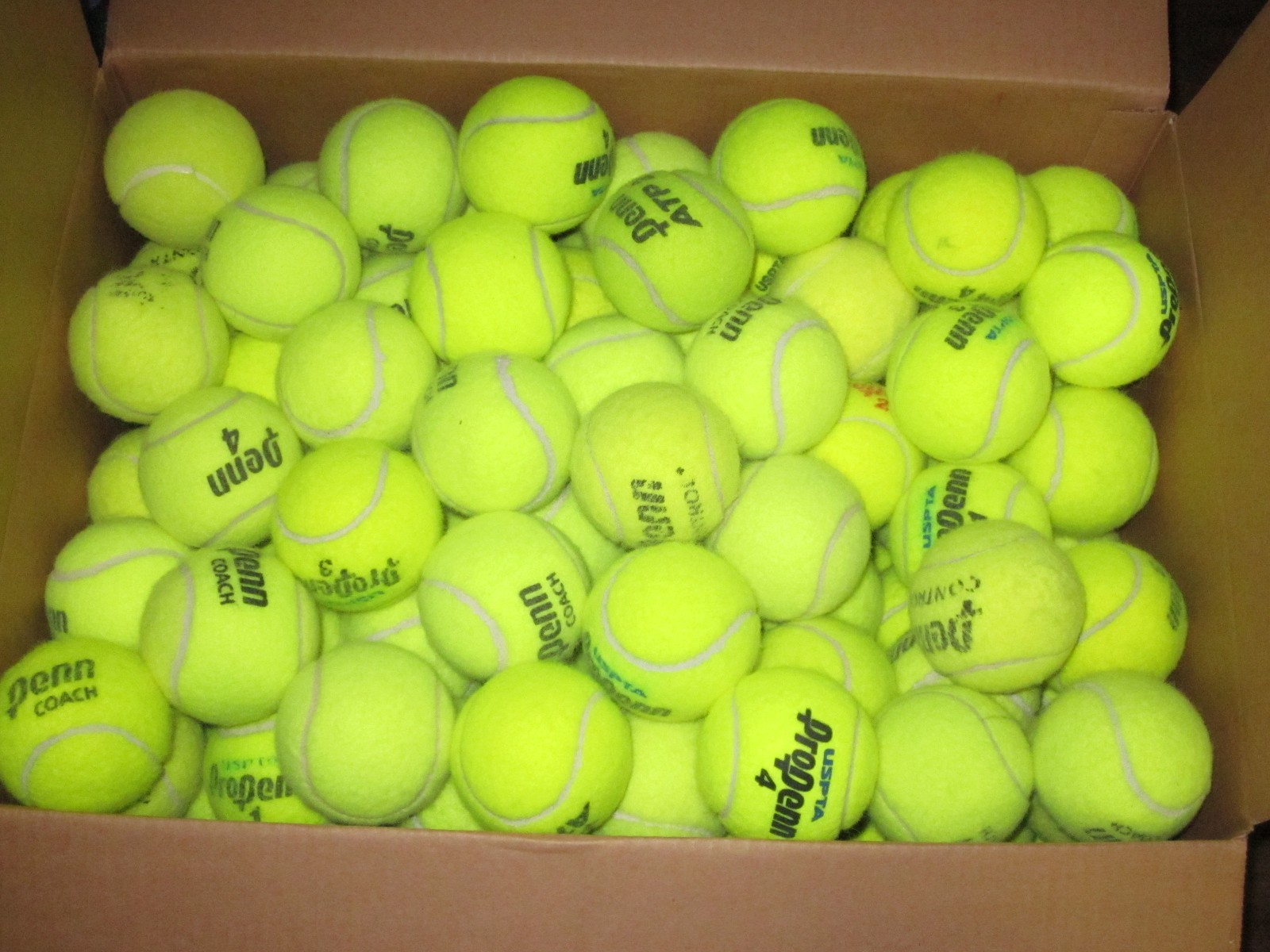 60 used tennis balls