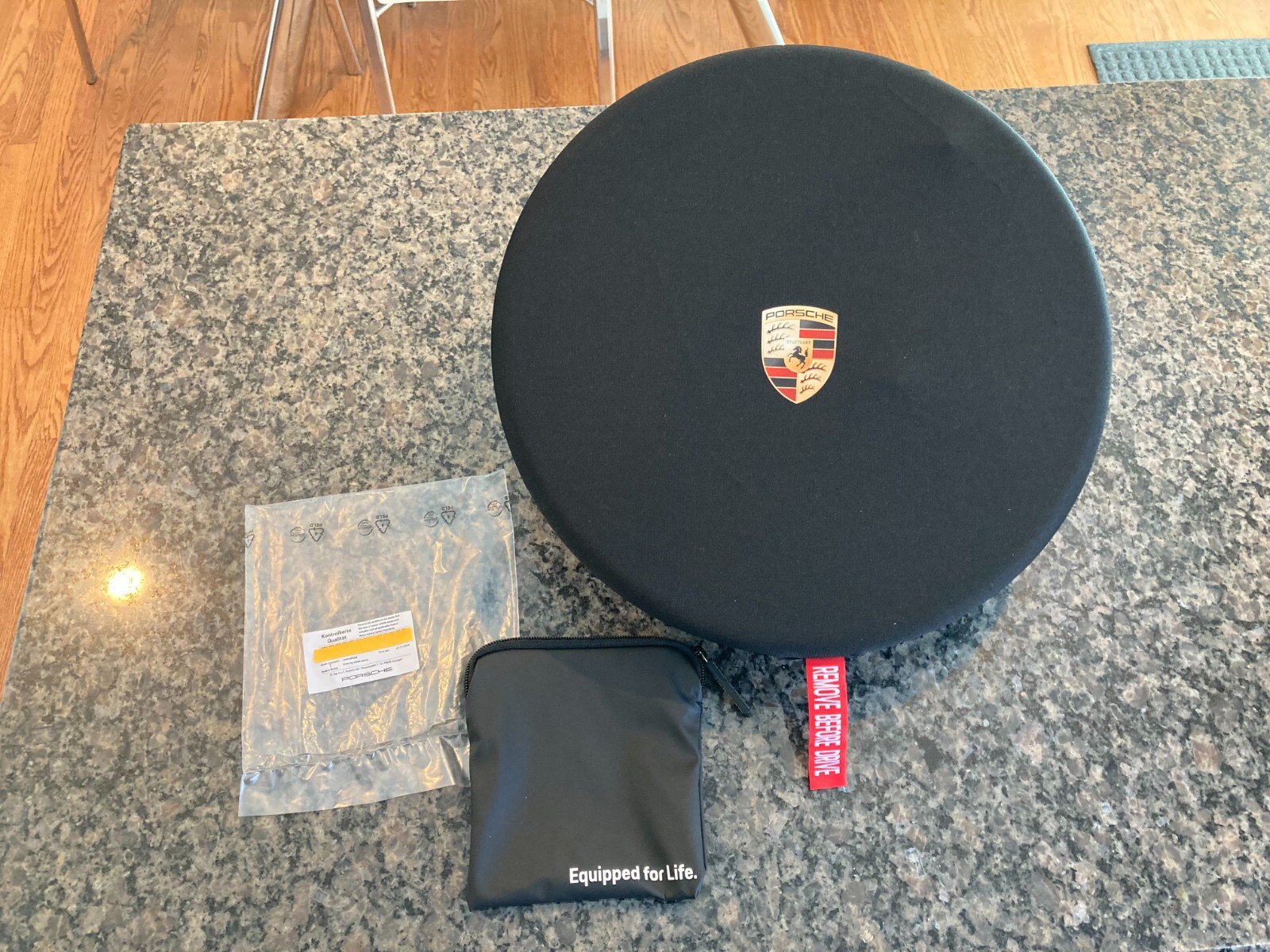 PORSCHE DESIGN OEM FACTORY STEERING WHEEL PROTECTIVE COVER IN BLACK W/CREST. NEW