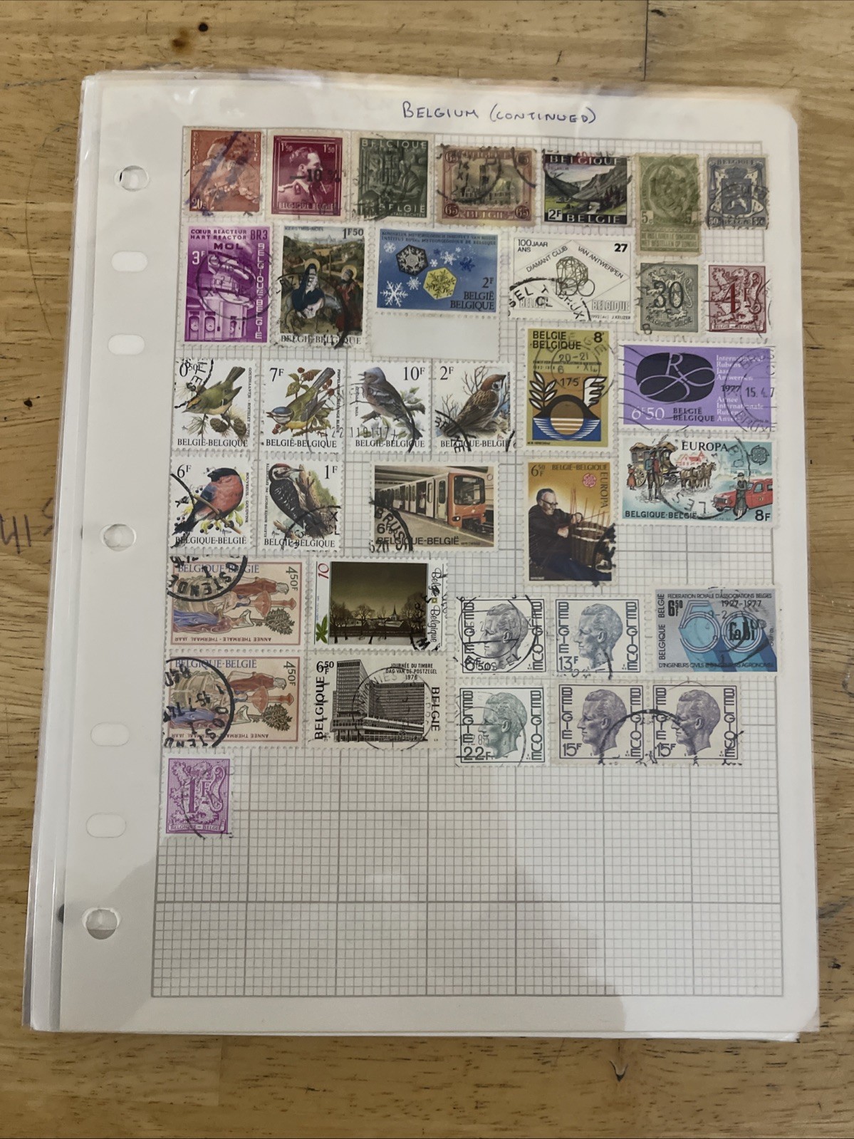 Lot of new and used stamps from all over the world. ON Paper.