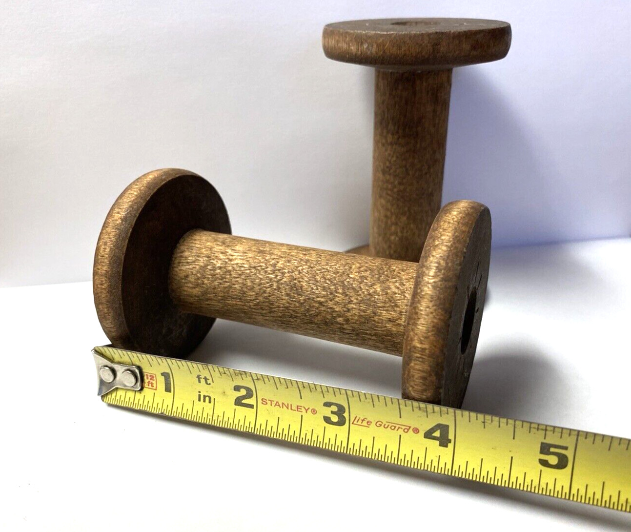 A Pair of 4 Inch Wooden Silk Spools
