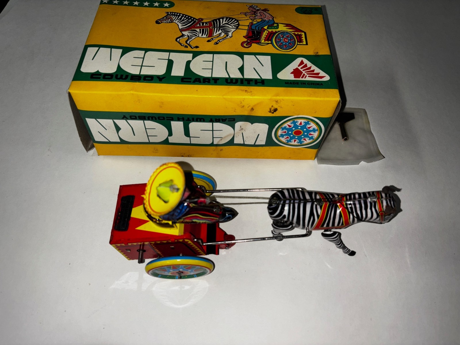 NOS New Vintage Tin Litho Wind-Up Toy Western Cowboy on Cart. MINT IN BOX w/key