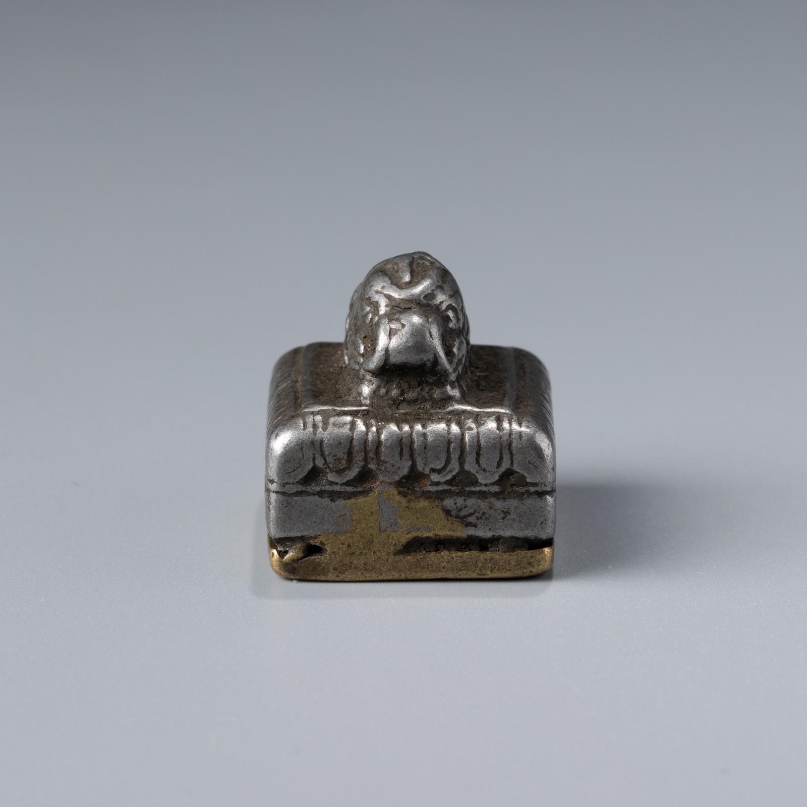 Tibetan Bronze and Iron Seal with Conch Motif