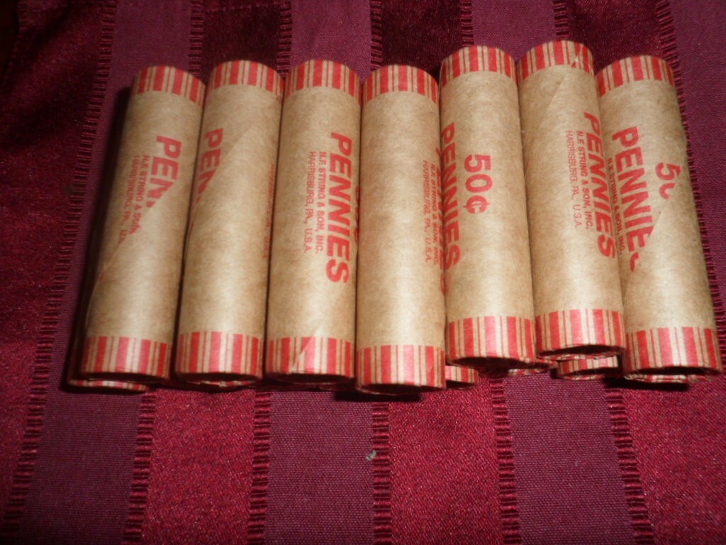 UNSEARCHED WHEAT CENT ROLL WITH INDIAN HEAD CENT ON END 1 bid = 1 roll