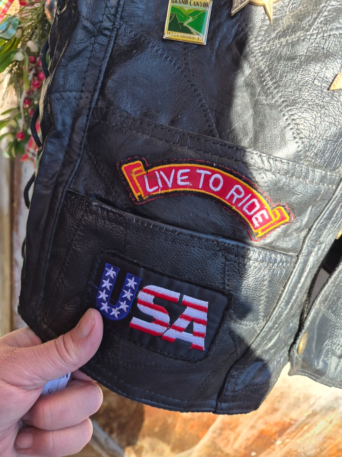 Vintage harley hog leather vest filled with pins and has patches 2xl