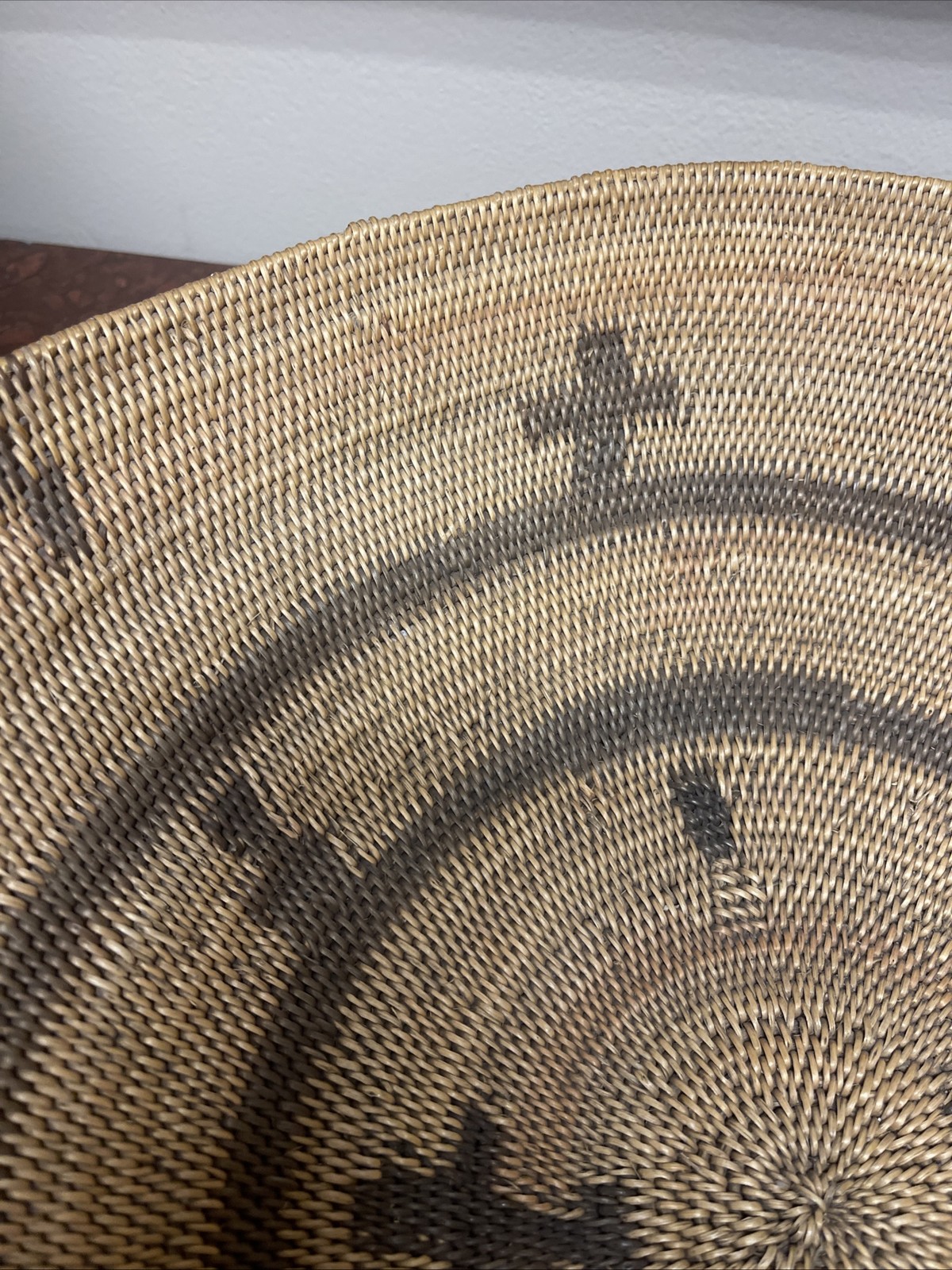 Woven Apache pictorial 17 1/4” basket with geometric and symbolic designs.