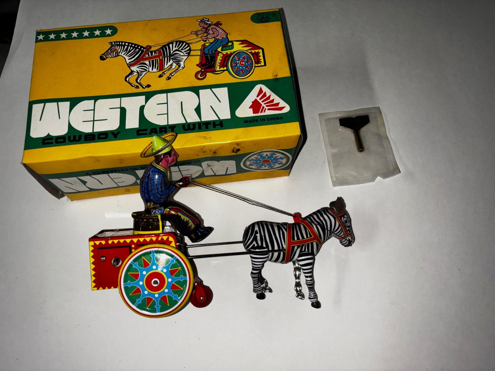 NOS New Vintage Tin Litho Wind-Up Toy Western Cowboy on Cart. MINT IN BOX w/key