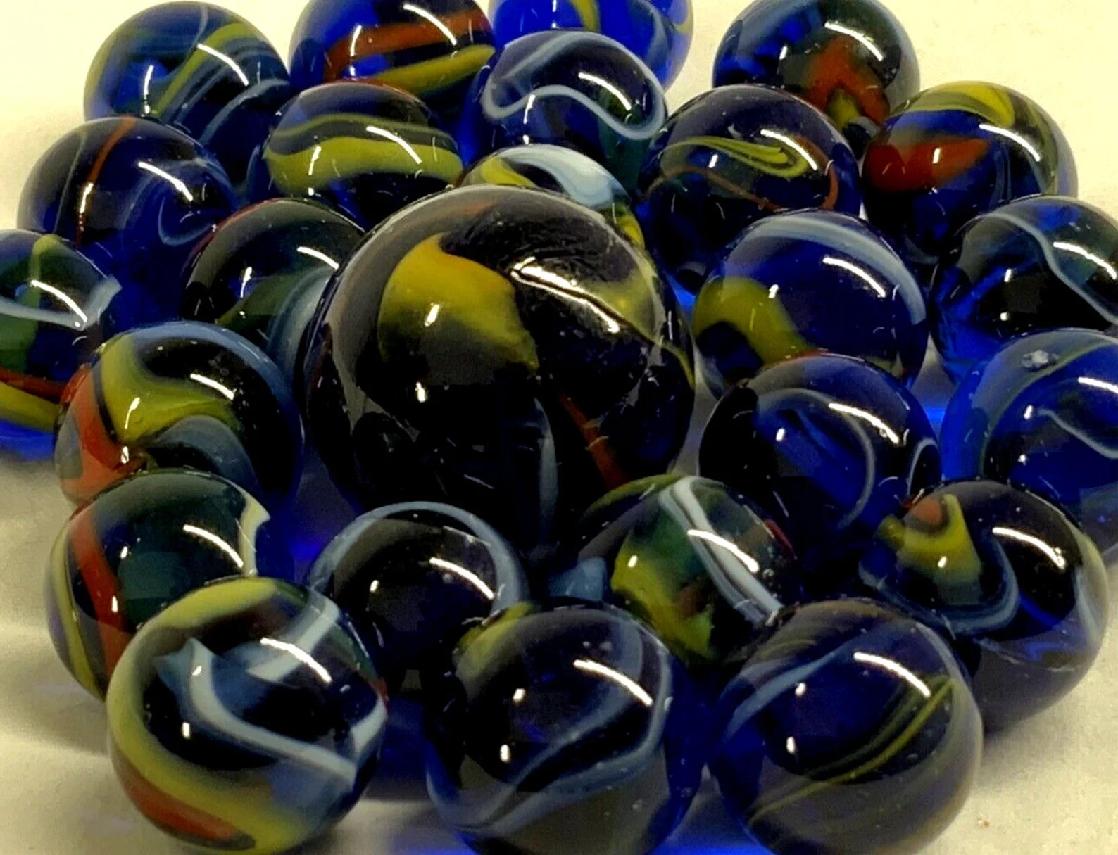 25 Glass Marbles ECLIPSE Translucent Blue Red/Yellow Swirl Pack Shooter