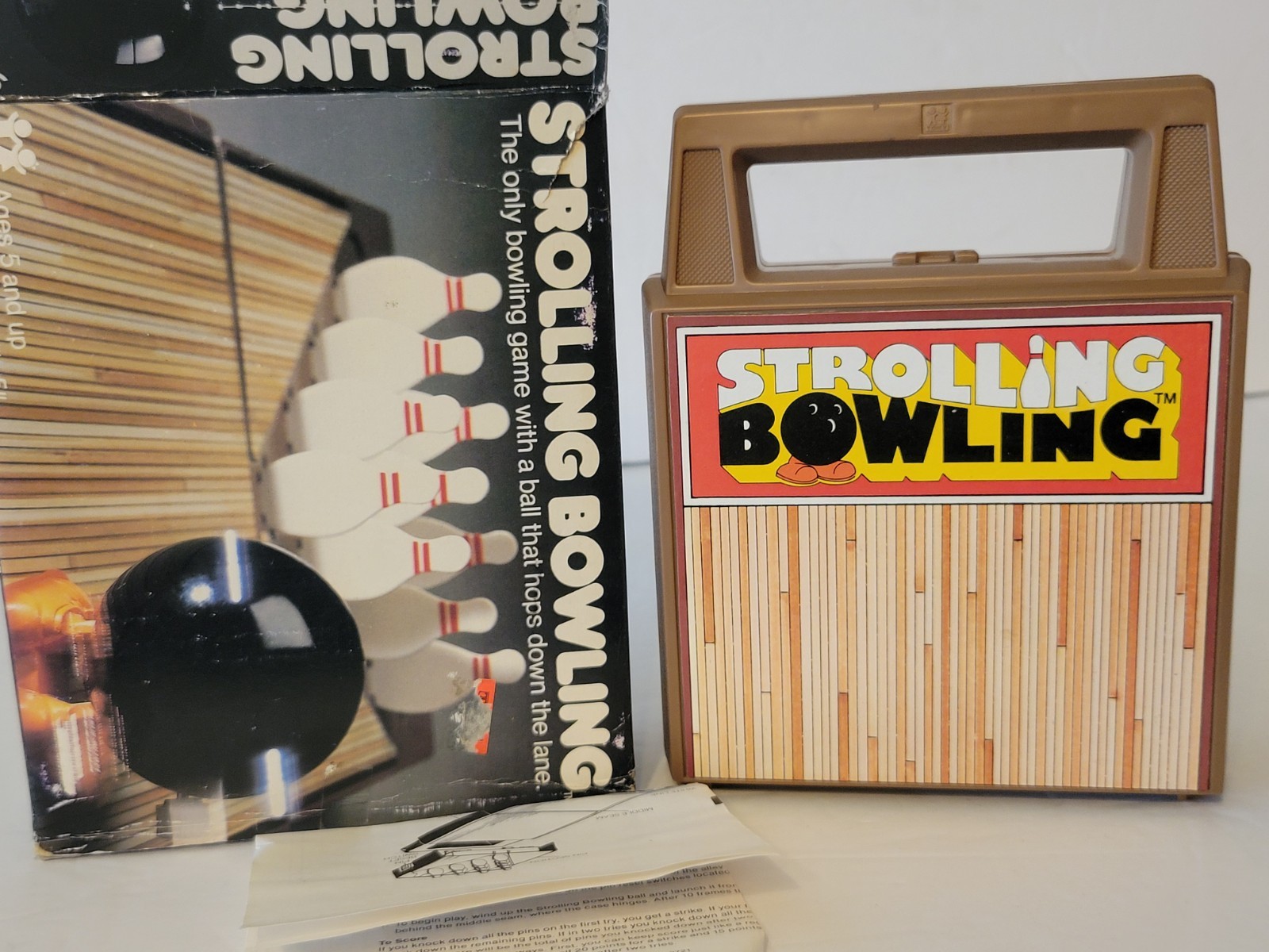 VINTAGE 1980s TOMY WIND UP STROLLING BOWLING GAME WITH BOX WORKING