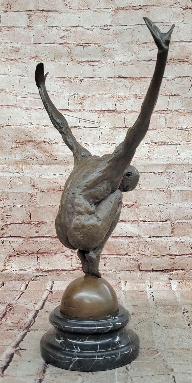 Abstract Bronze Male Figure Balancing on Sphere with Outstretched Arms Sculpture