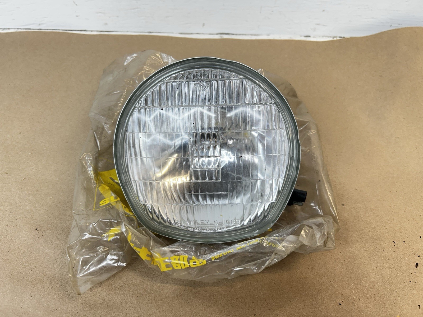 1972 Suzuki TS 400 New Old Stock 12V Headlight 35121-18610