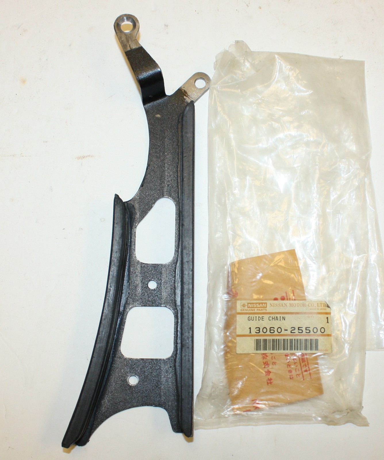 Datsun 2000 Roadster Upper Timing Chain Guide: Nissan Part 13060-25500