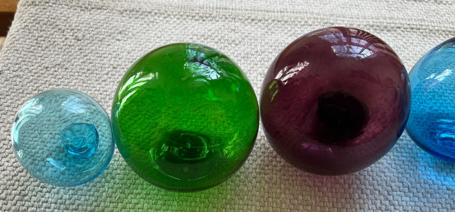 Lot of 7 vintage hand blown glass fishing floats or balls.