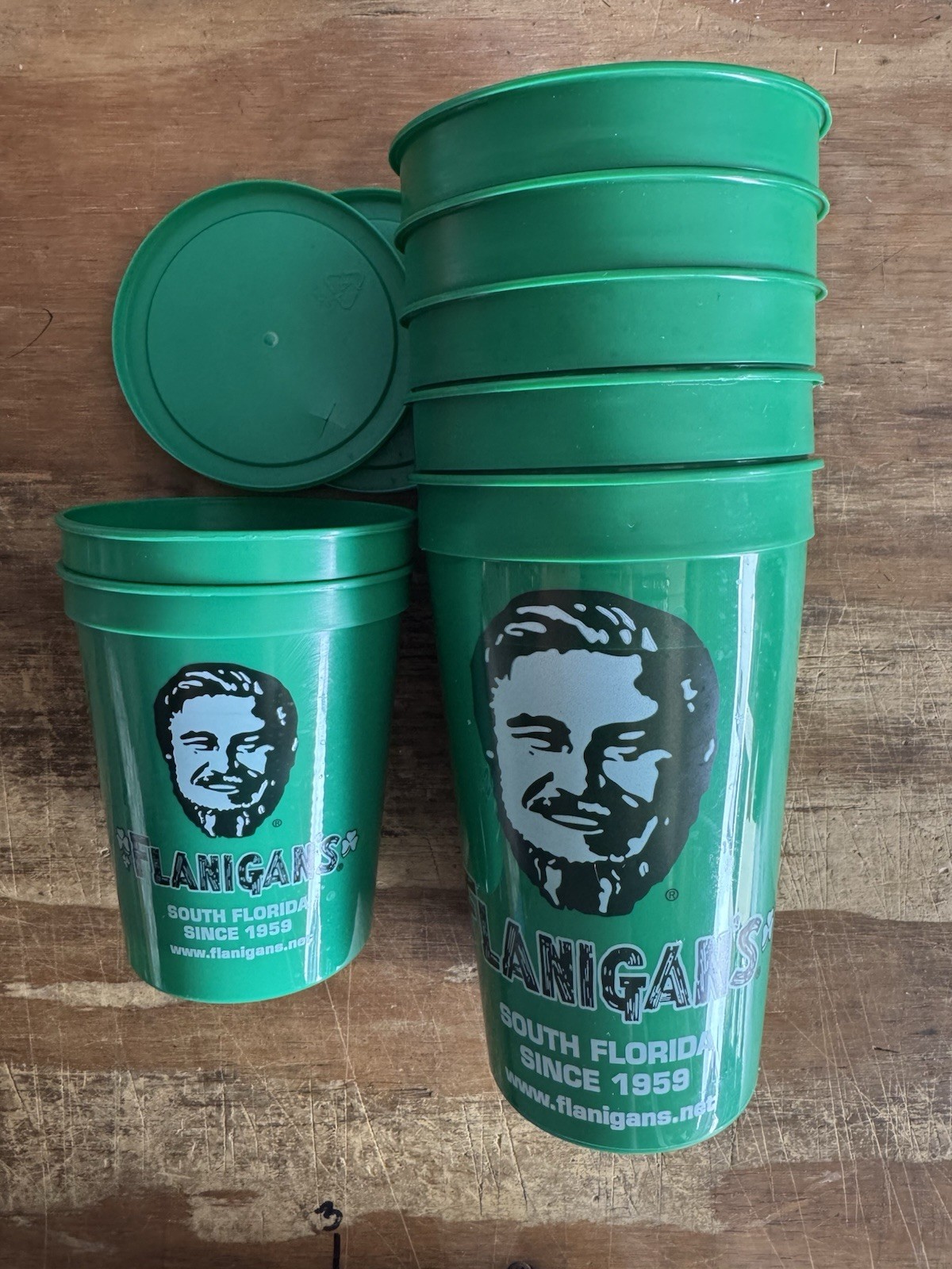 Set Of 7 Flanigan’s Cups 5 Large Green & 2 Kids With Lids Used Free Shipping