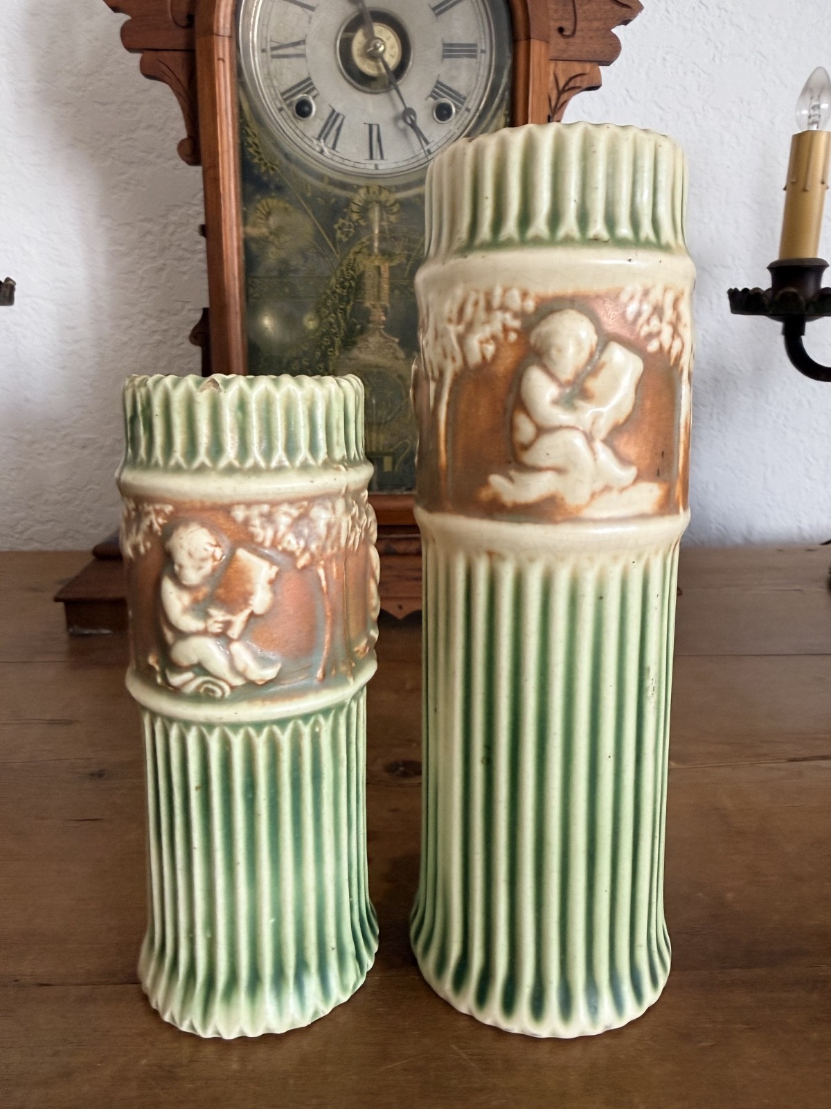 Pair Antique Roseville Donatello Cherub Bud Vases Green Art Pottery 1916