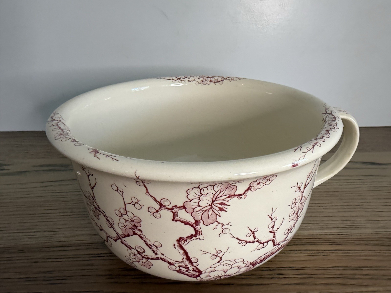 Antique Chamber Pot With A Red Transferware Pattern
