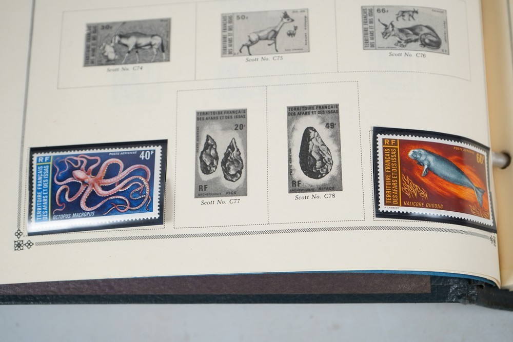 WORLDWIDE A-L 1970s COLLECTION OF 875+ STAMPS MINT & USED STORED IN SCOTT ALBUM