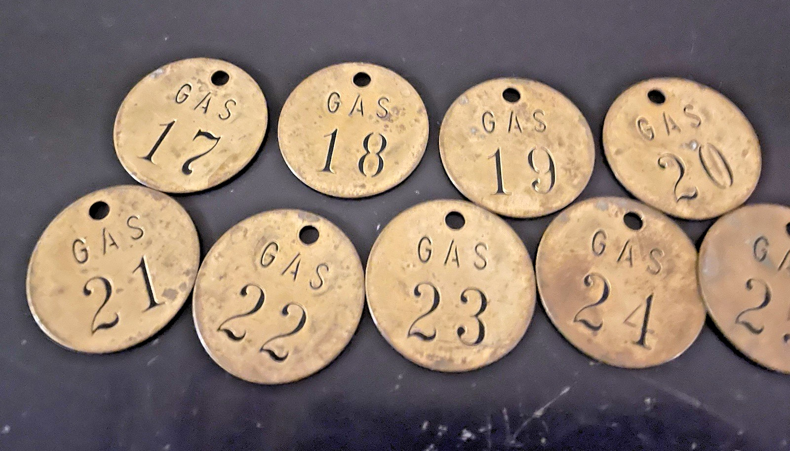 Lot of 9 vintage brass gasoline tags