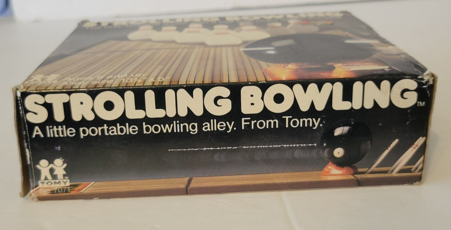 VINTAGE 1980s TOMY WIND UP STROLLING BOWLING GAME WITH BOX WORKING