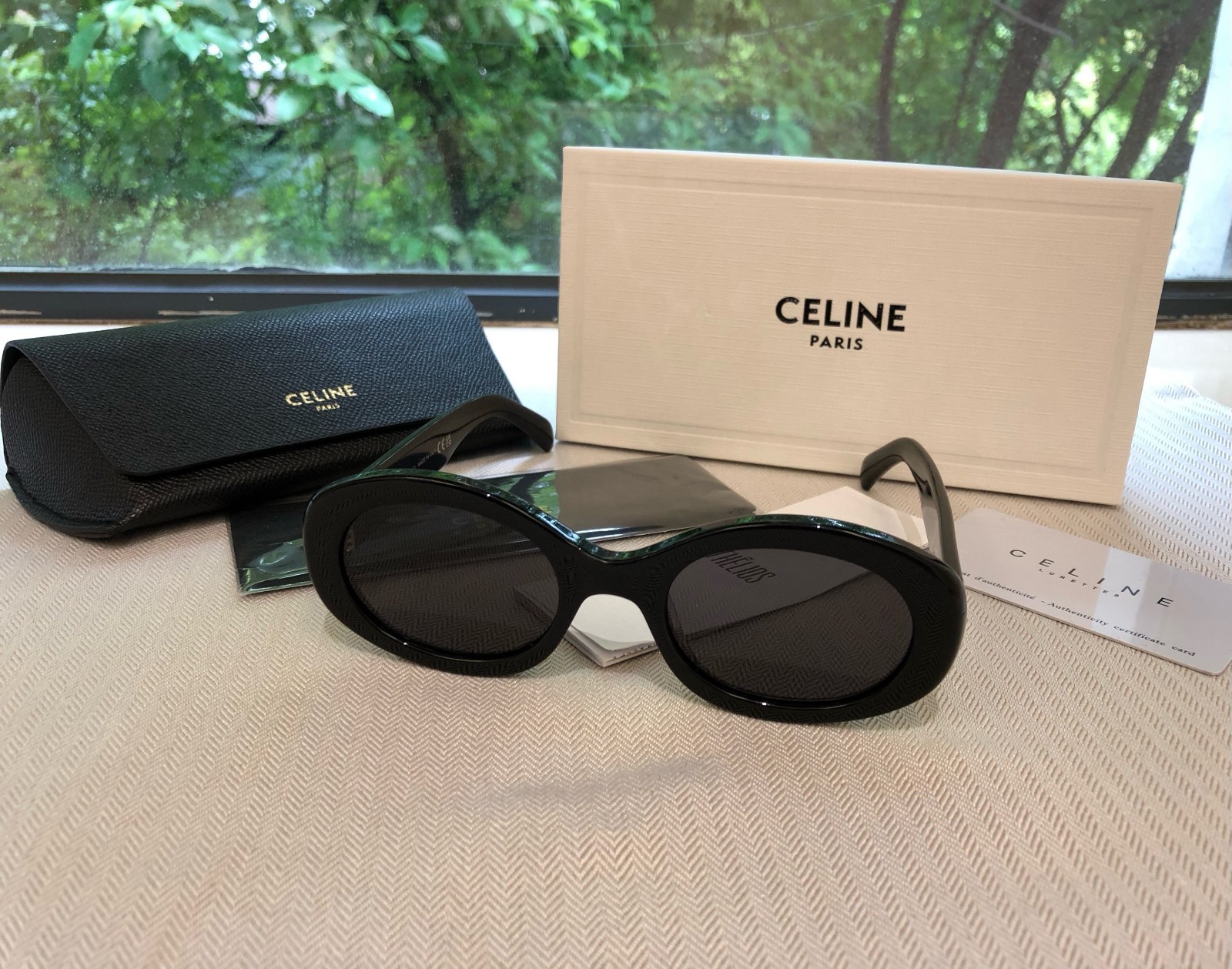 Celine CL40194U Triomphe Oval Sunglasses Black Frame Dark Grey Lens Women