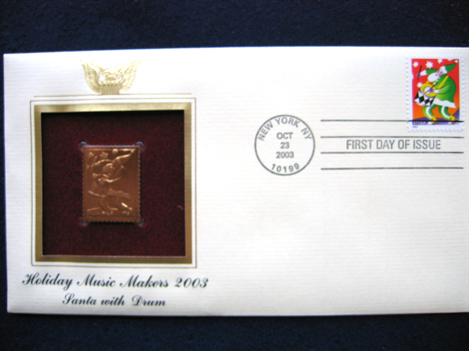 2003 Holiday Music Makers Santa With Drum Replica Gold Golden Cover Stamp