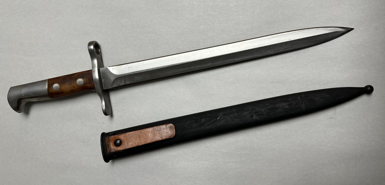 SWISS K31 BAYONET WITH SCABBARD. NEW OLD STOCK.