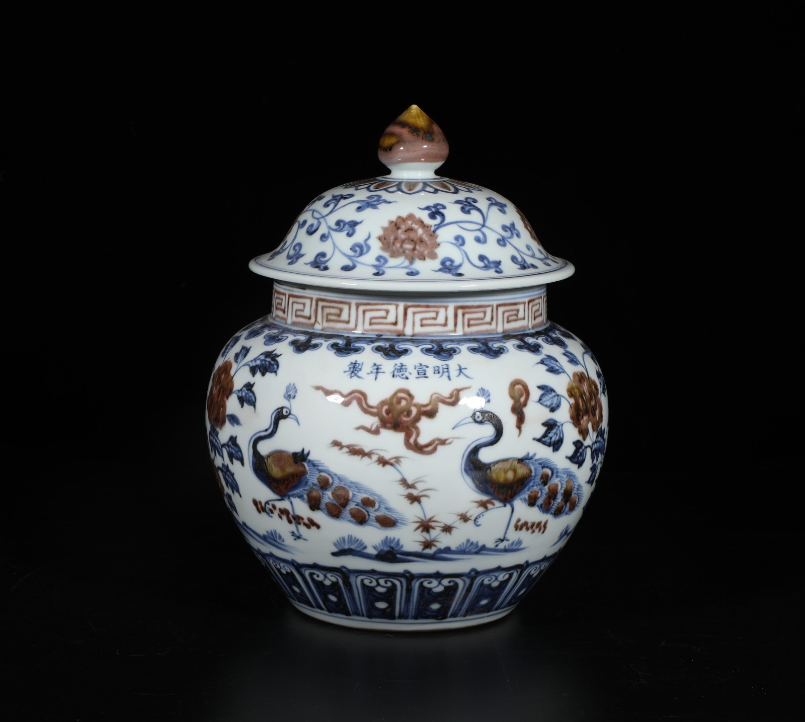 An Iron Red Blue & White Porcelain Jar with lid. 'xuanDe' mark