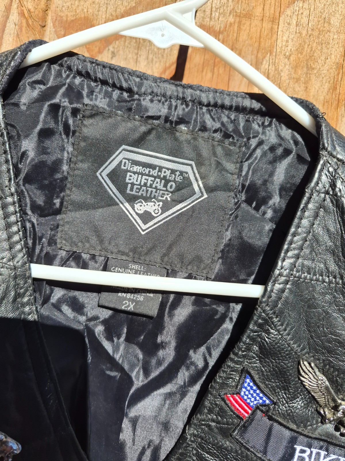 Vintage harley hog leather vest filled with pins and has patches 2xl