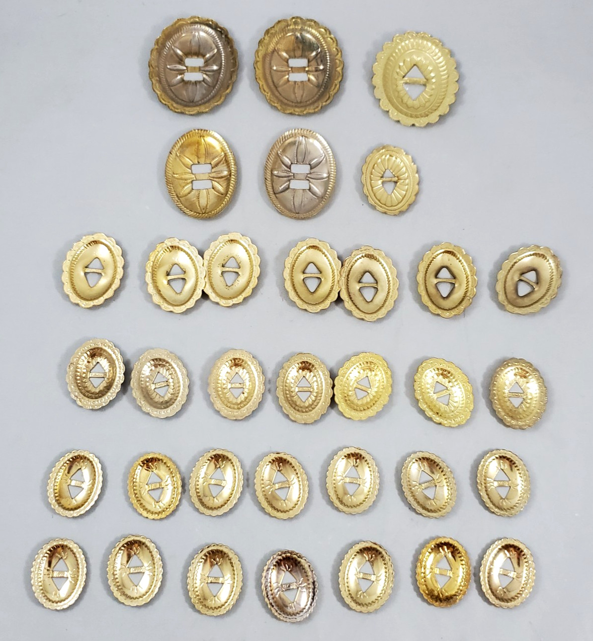 Lot of 34 Slotted Oval Conchos Brass Tone Scalloped Different Sizes Crafts Vtg