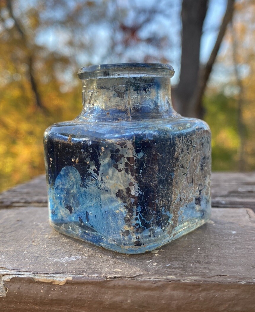 Clear Inkwell With Blue Ink And Partial Label