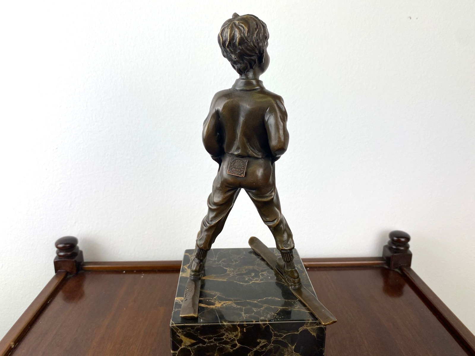 Bronze sculpture boy with ski on marble base after Ferdinand Preiss