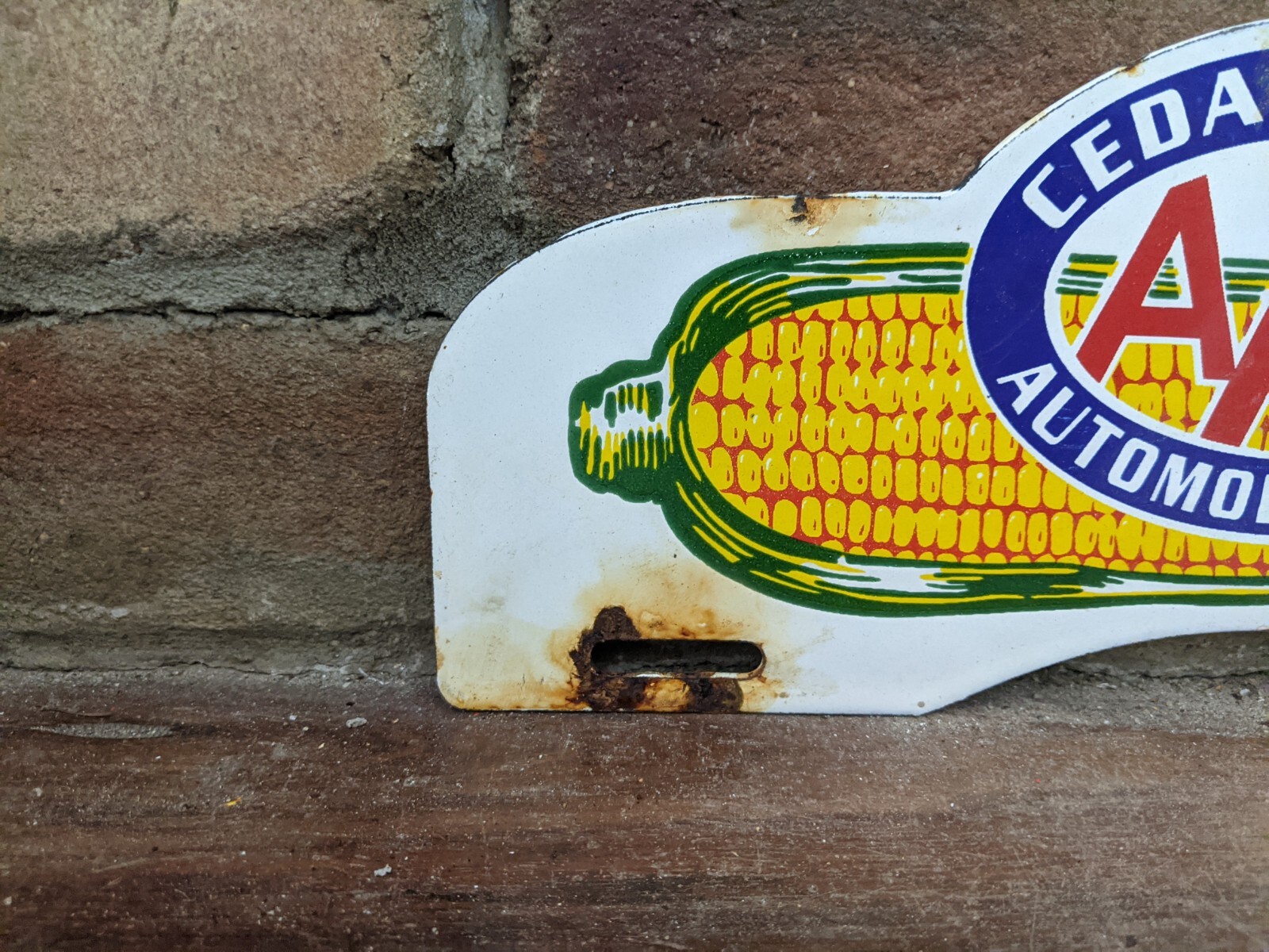 VINTAGE CEDAR RAPIDS AAA CORN PORCELAIN LICENSE PLATE HOLDER SIGN 11" X 4.5"