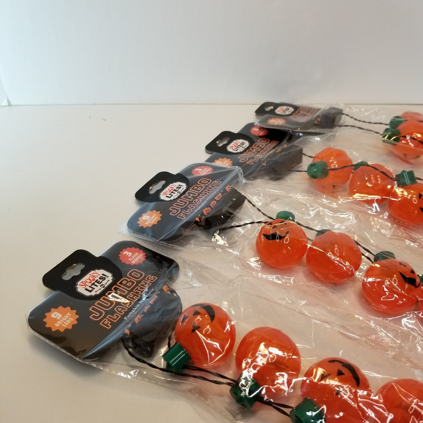 Light up Pumpkin Jack O Lantern Necklace Halloween 9 Bright LEDs 3 Flash modes.