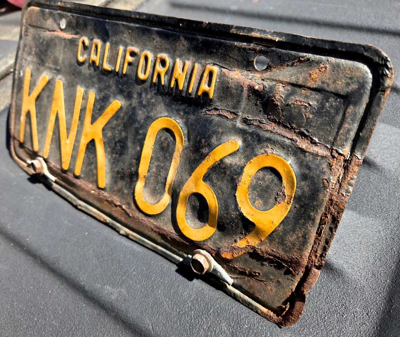 California License Plate KNK 069 Yellow on Black 1963 Vintage CA State 63