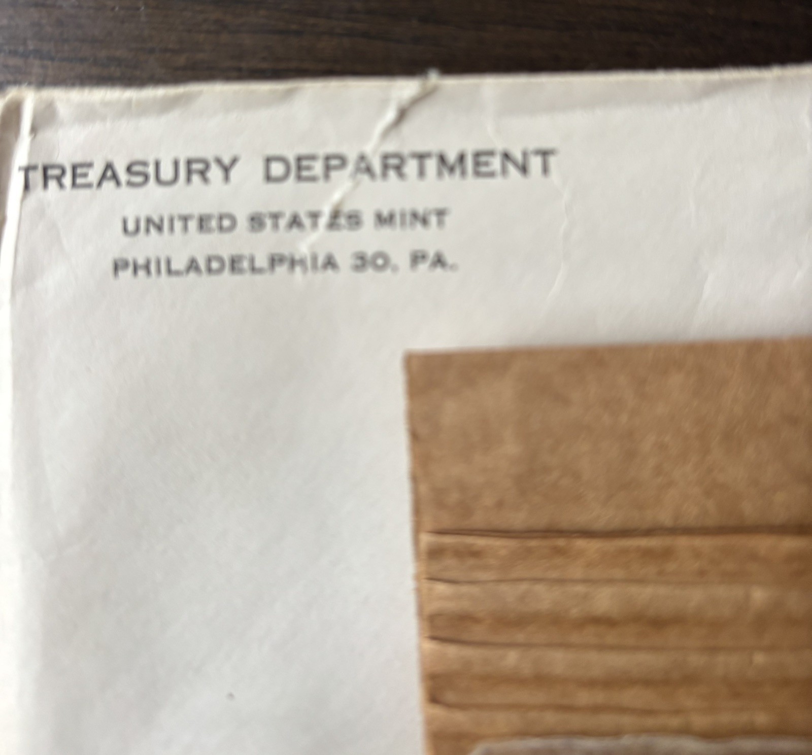 1957 U.S. PROOF SET. Coins U.S. Mint Sealed in a flat cello. (Tear in envelope)