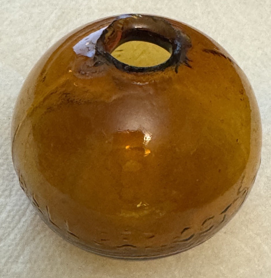 SUPER RARE ANTIQUE IRA PAINE’S FILLED AMBER GLASS TARGET/SHOOTING BALL, 2.5”