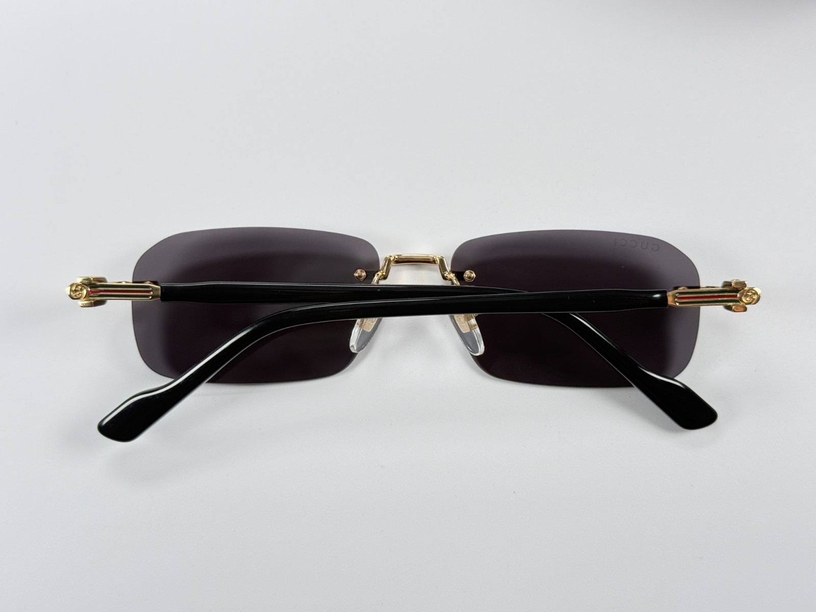 Gucci GG1221S 001 Black Gold Rimless Sunglasses Gray Lens 56mm