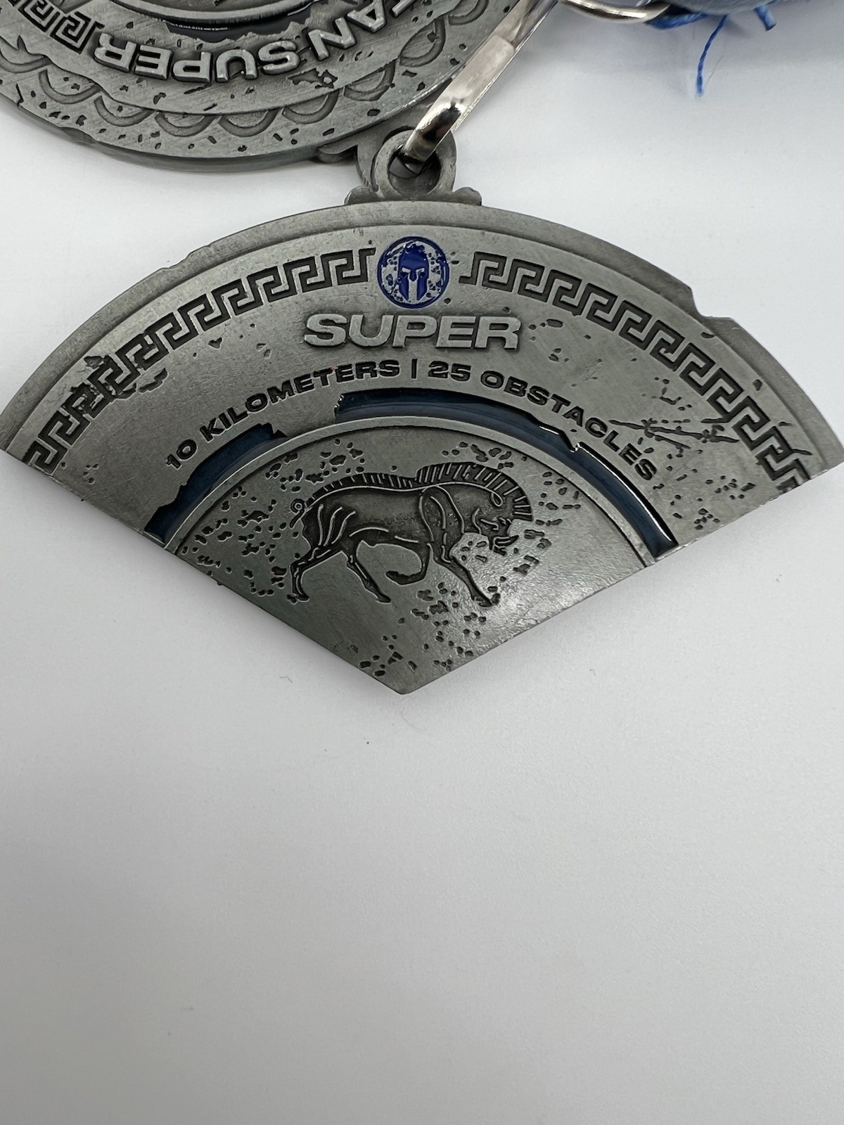 Spartan Super 2025 Finisher Medal Silver Blue 10 Kilometers 25 Obstacles