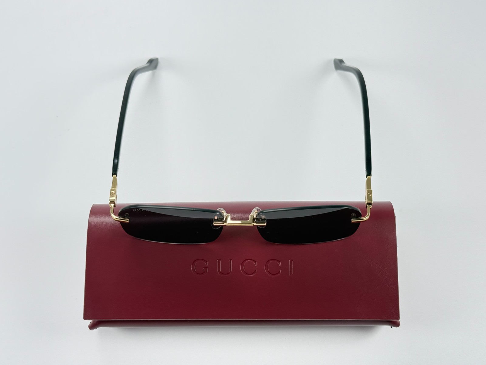 Gucci GG1221S 001 Black Gold Rimless Sunglasses Gray Lens 56mm