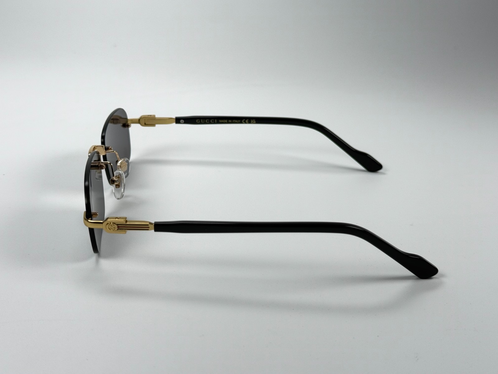 Gucci GG1221S 001 Black Gold Rimless Sunglasses Gray Lens 56mm