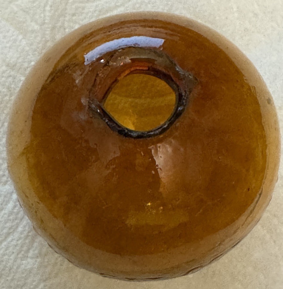 SUPER RARE ANTIQUE IRA PAINE’S FILLED AMBER GLASS TARGET/SHOOTING BALL, 2.5”