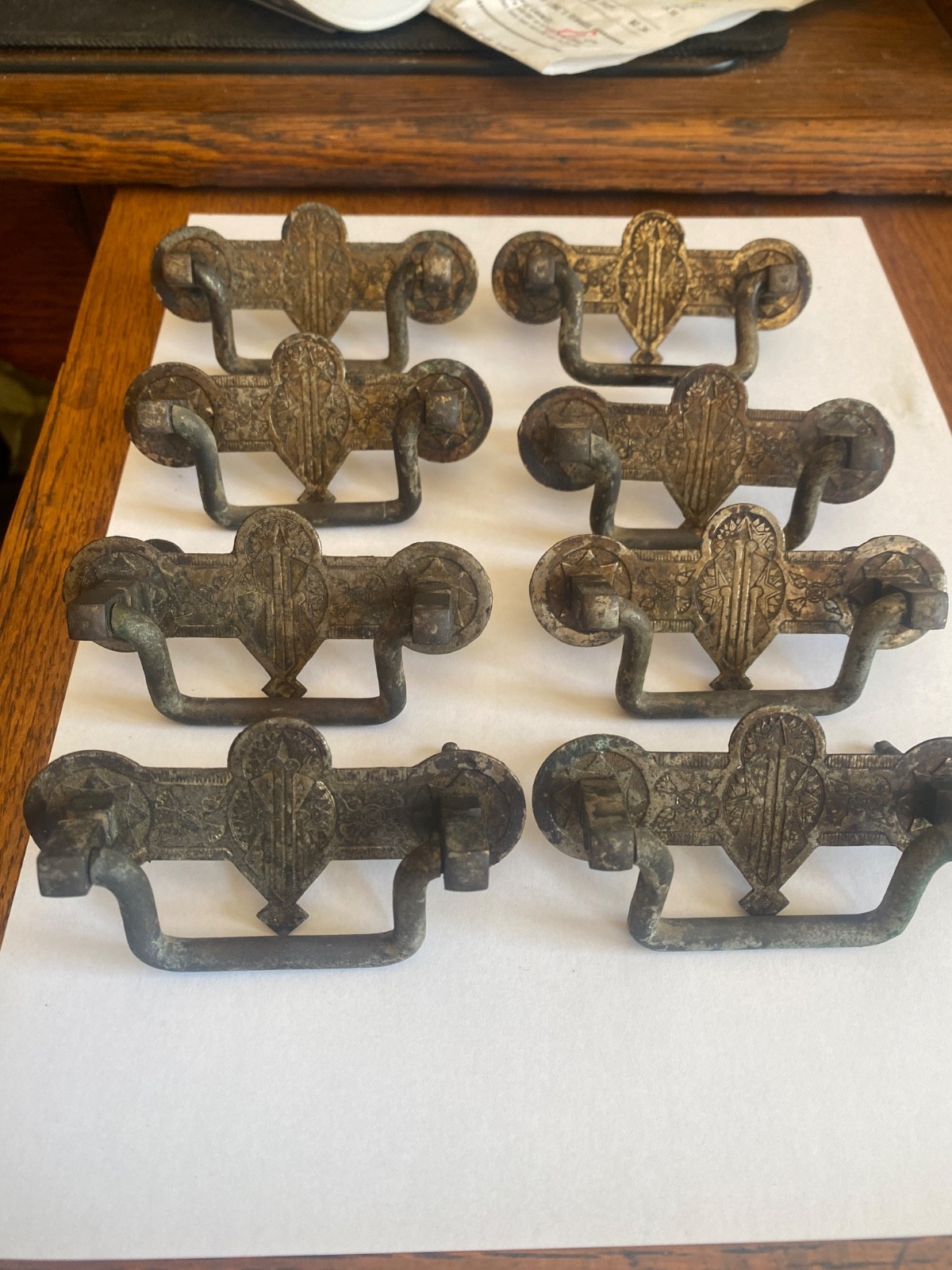 Eight- 2.5' center original brass Eastlake drawer  pulls.  Salvaged -not cleaned